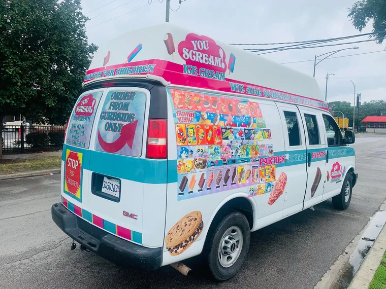The rear of the truck showing the full illustrated menu board of every treat available